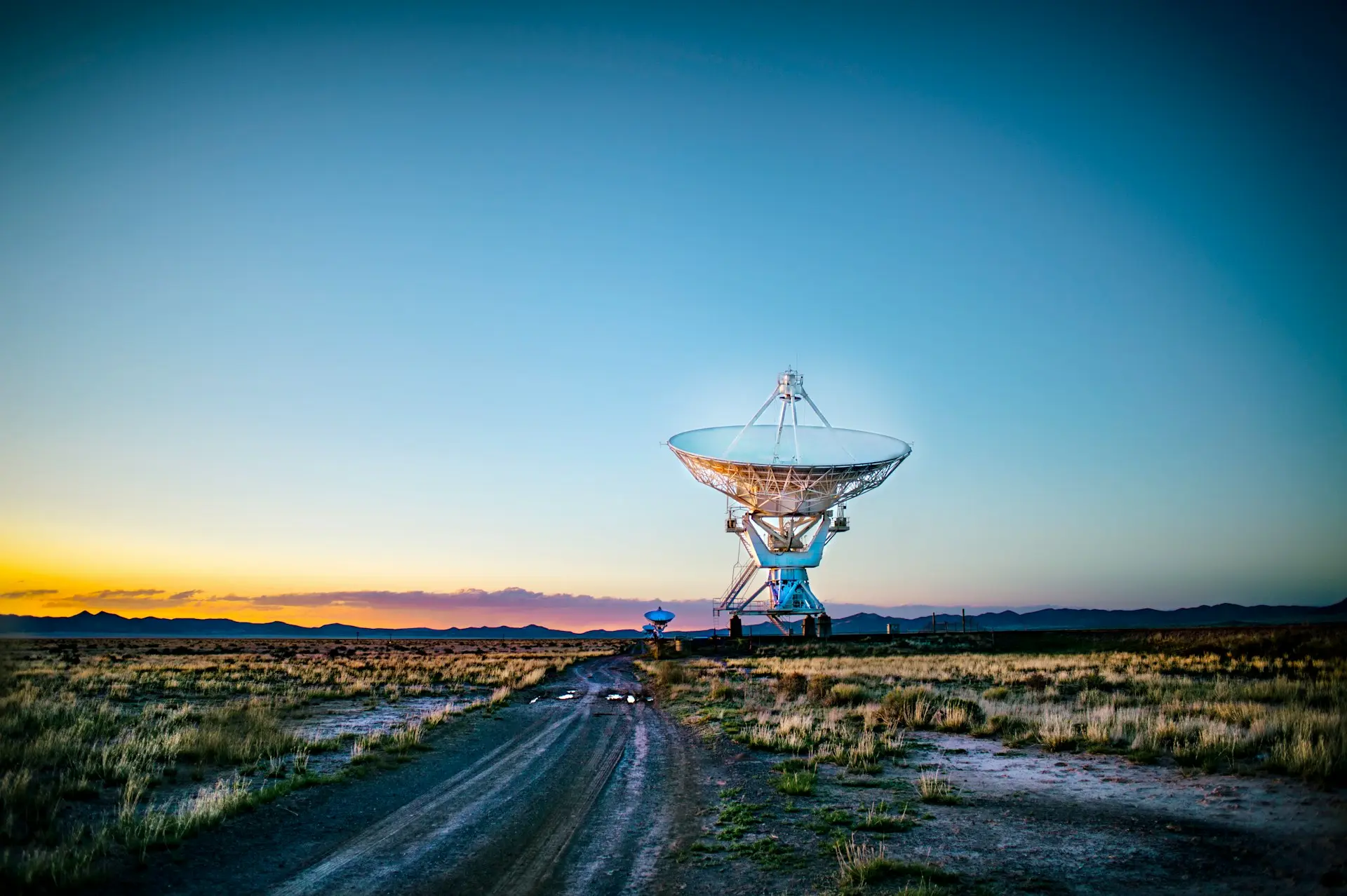 white radar telescope on grass field